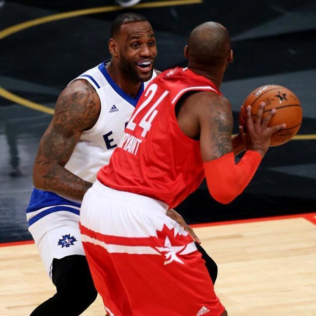 LeBron James #23 of the Cleveland Cavaliers and the Eastern Conference smiles as he defends Kobe Bryant #24 of the Los Angeles Lakers and the Western Conference in the first half during the NBA All-Star Game 2016 at the Air Canada Centre on February 14, 2016 in Toronto, Ontario